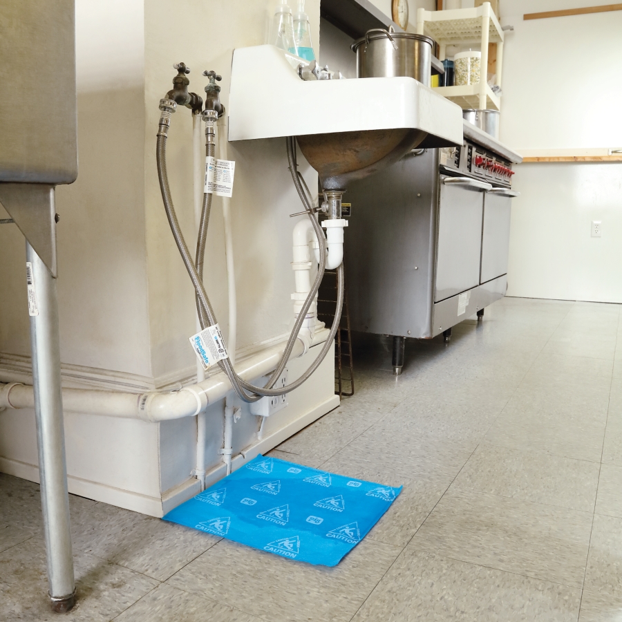 Absorbent pads for fast response to spills, water ingress and